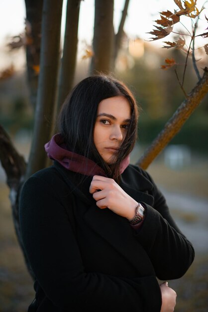 Girl wearing a warm autumn coat on a cold day