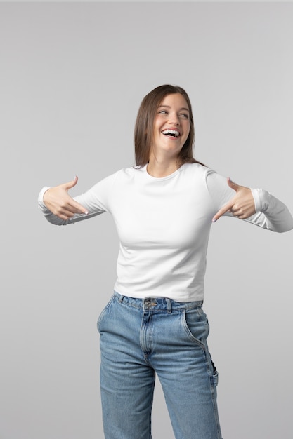 Girl wearing white t-shirt posing in studio