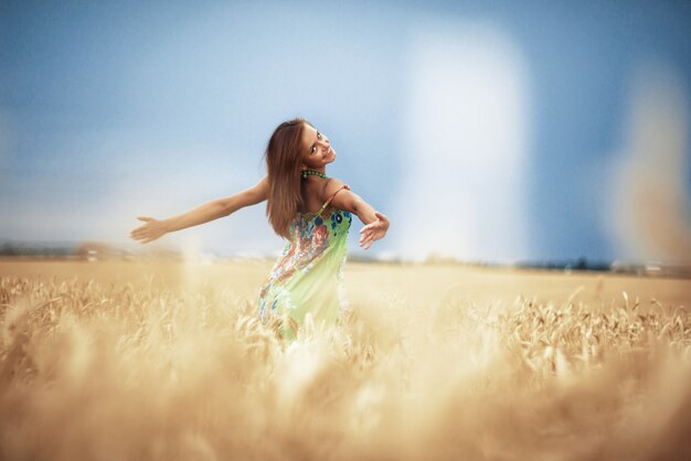 Girl in wheat meadow