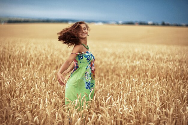 Girl in wheat meadow