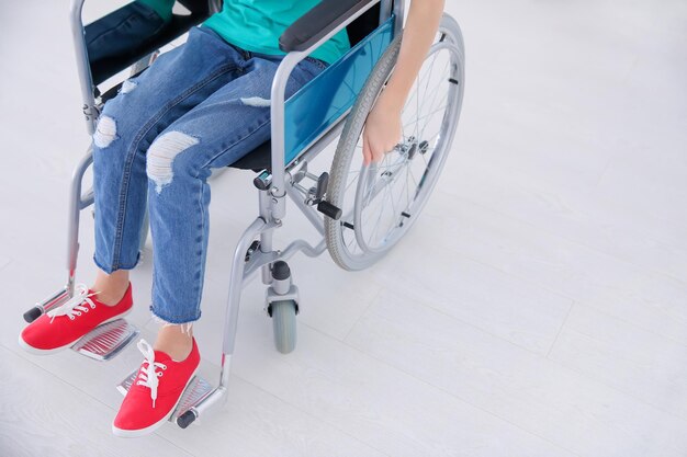 Girl in wheelchair indoors