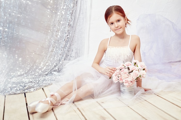 Girl in a white ball gown and shoes, beautiful