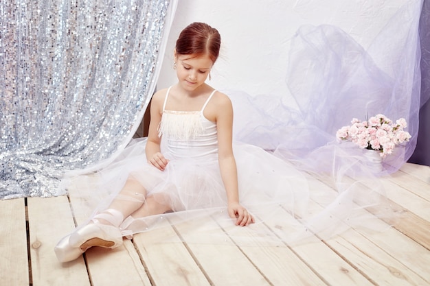 Girl in a white ball gown and shoes