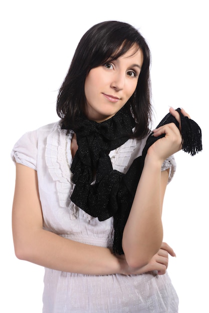 Girl in a white blouse with a black scarf isolated