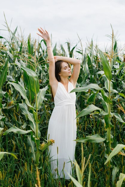 Girl in white dress-organic corn in the enjoy eco nature