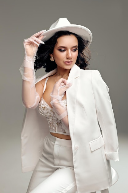 Girl in white hat and white suit