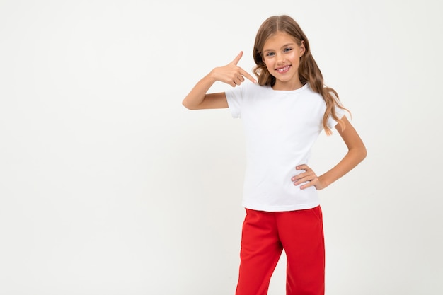 girl in white and red costume smiles isolated on white