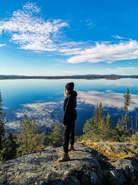 A girl on the White Sea coast on a sunny day Karelia Russia SEPTEMBER 2021