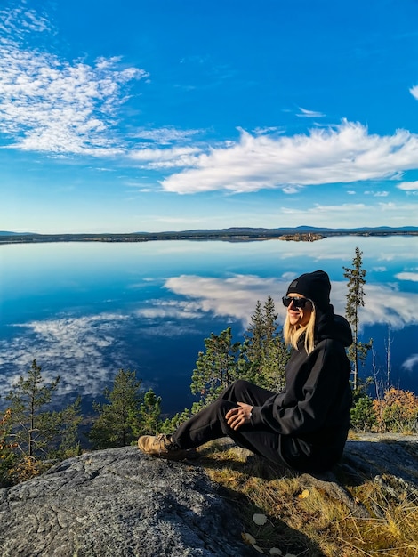 A girl on the White Sea coast on a sunny day Karelia Russia SEPTEMBER 2021