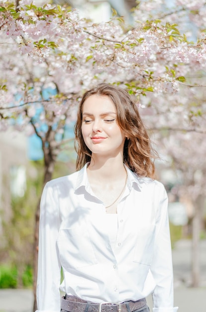 Girl in a white shirt with sakura