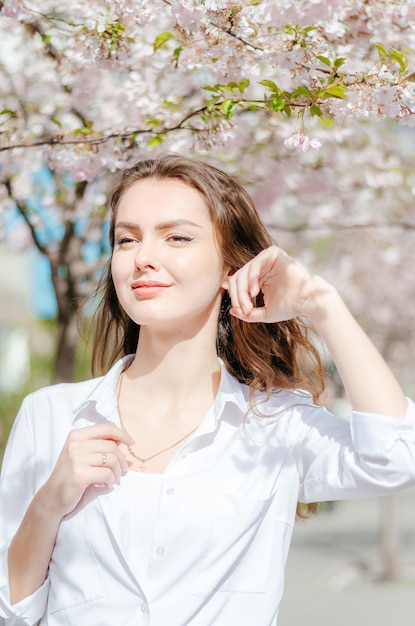 Girl in a white shirt with sakura