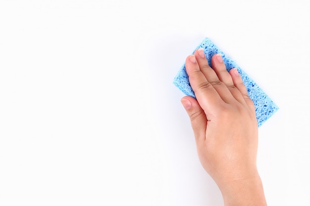 The girl wipes her hands on a white with blue sponge. Top view.