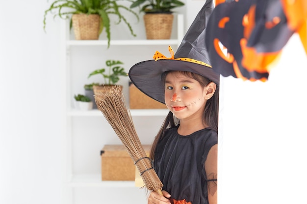Girl in witch costume during halloween