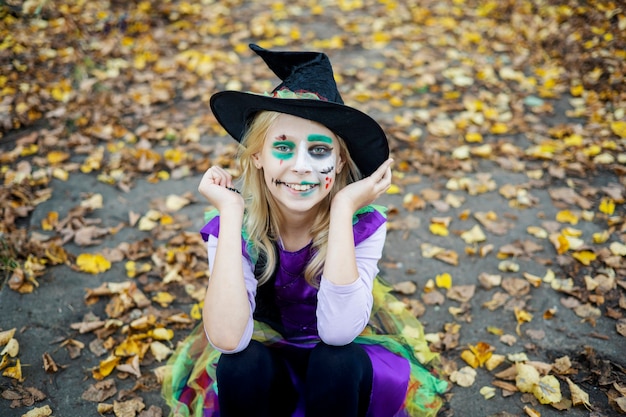 A girl in a witch costume for Halloween