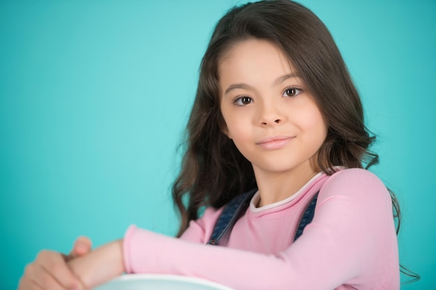 Girl with adorable face on blue background