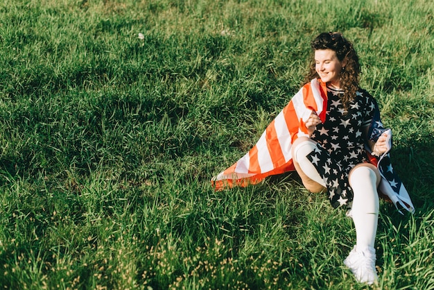 Girl with an american flag independence day