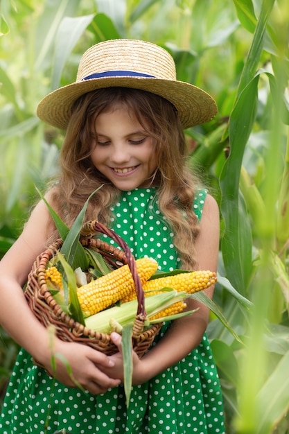 girl with a basket of corn