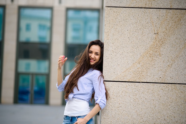 Girl with beautiful hair on the street.