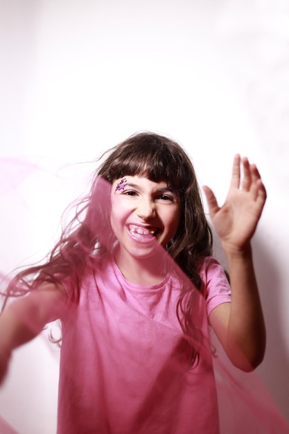 Girl with big smile and happy make-up on white background