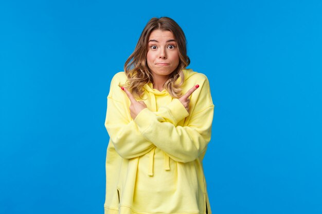 Girl with blond hair in yellow hoodie