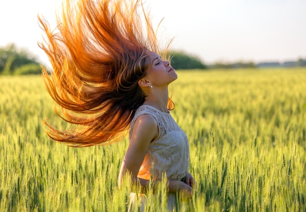 Girl with blowing red hair