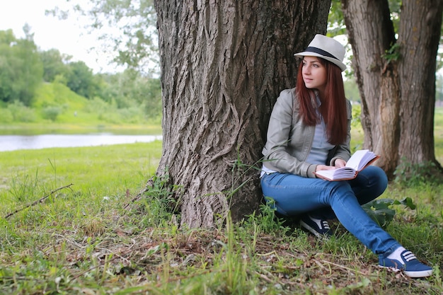 Girl with book in park