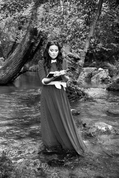 girl with a book on the river