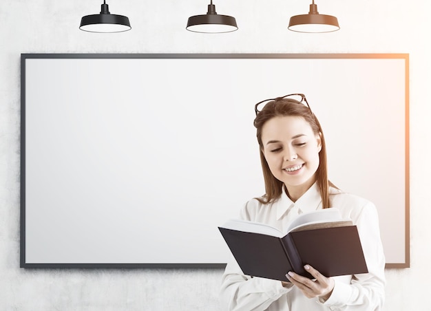 Girl with a book and a whiteboard