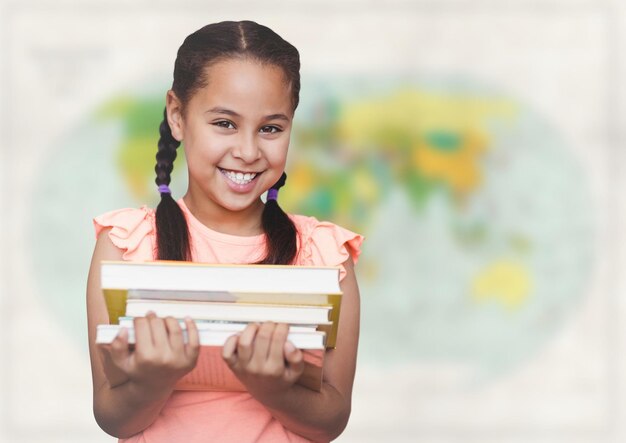 Girl with books against blurry map