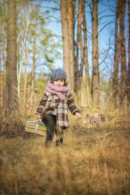 Girl with books and Apple. Selective focus.