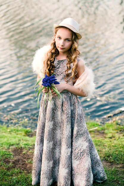 girl with a bouquet of blue flowers