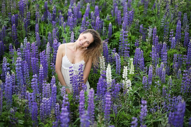 Girl with a bouquet of blue flowers