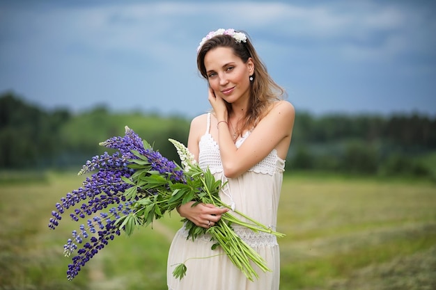 Girl with a bouquet of blue flowers