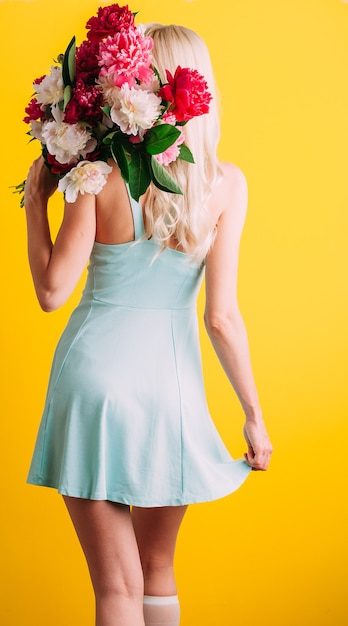 Girl with a bouquet of flowers