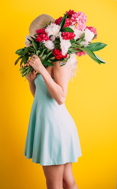 Girl with a bouquet of flowers