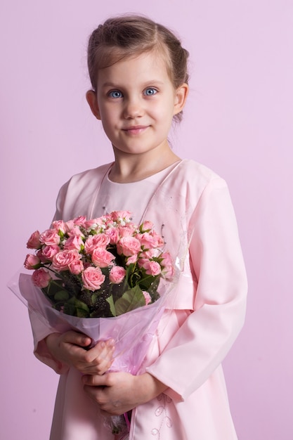 Girl with a bouquet of roses