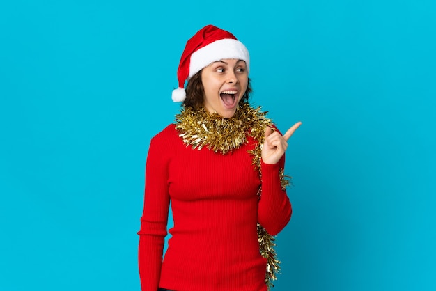 Girl with Christmas hat on a blue background