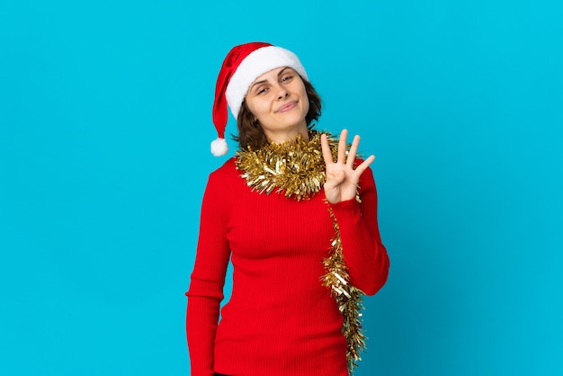 Girl with Christmas hat on a blue background