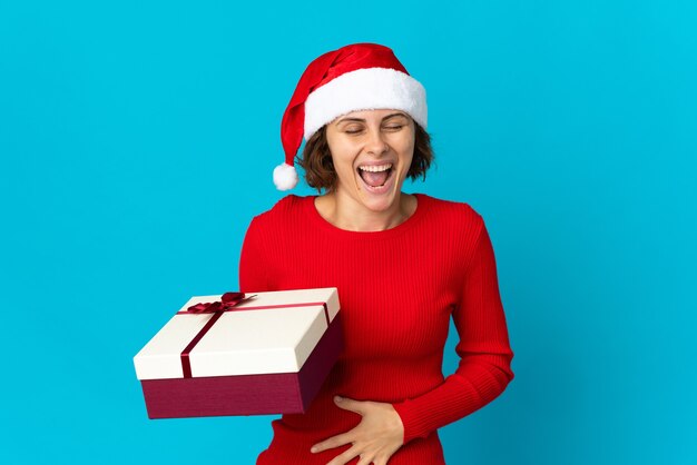 Girl with Christmas hat on a blue background