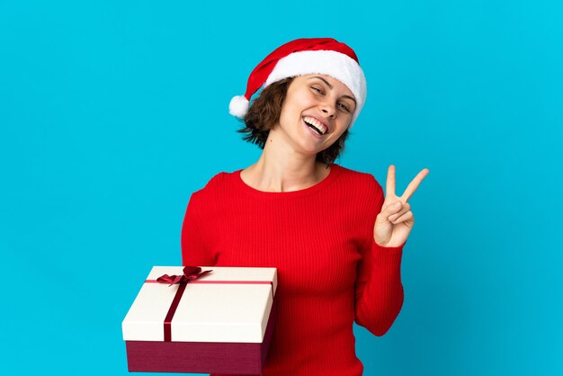 Girl with Christmas hat on a blue background