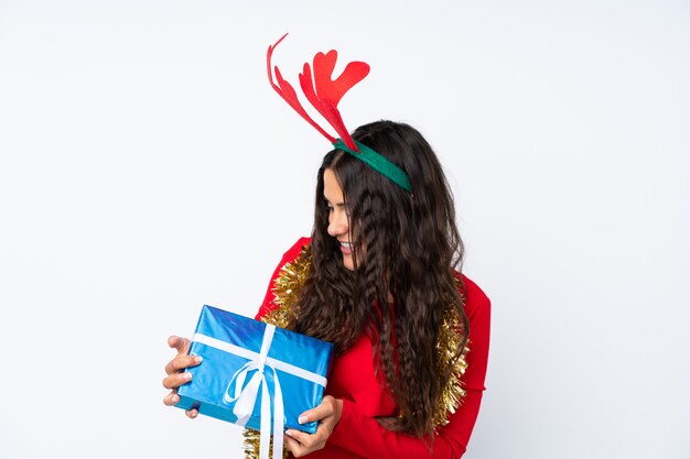 Girl with christmas hat over isolated white background