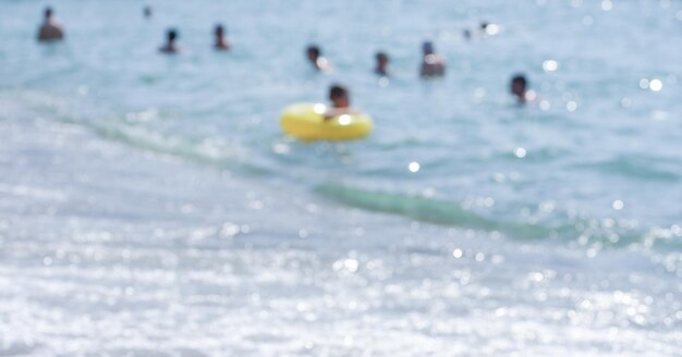 Girl with a circle in the sea defocused photo