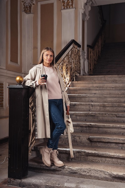 A girl with coffee in her hands