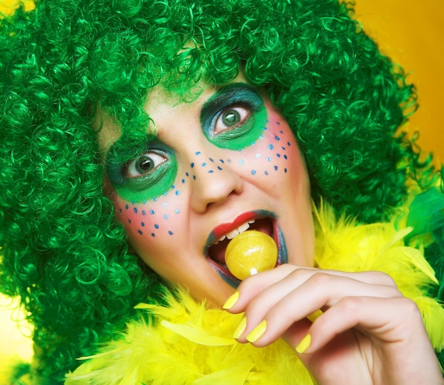 Girl with creative visage with lollipop