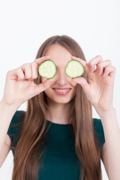 Photo girl with cucumber eyes