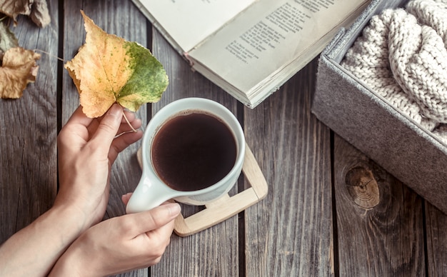 Girl with a cup of coffee in hands