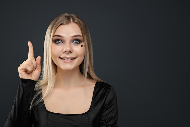 A girl with dark makeup for a Halloween party