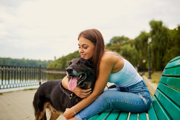 Girl with a dog in the park