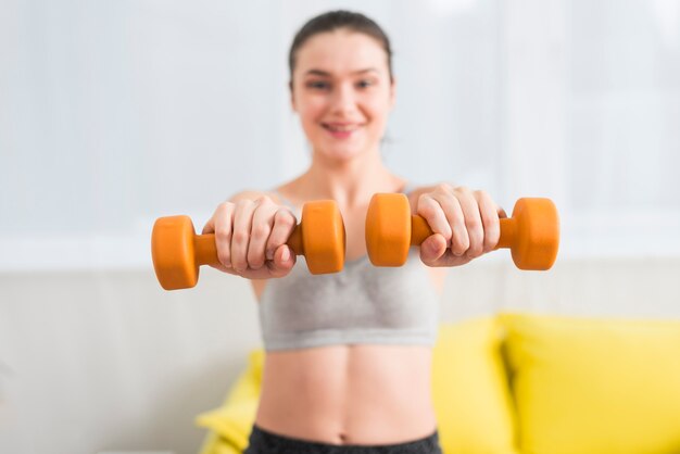 Girl with dumbbells 