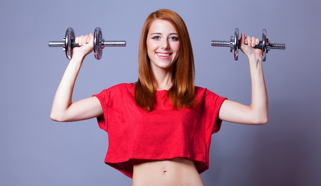 Girl with dumbbells